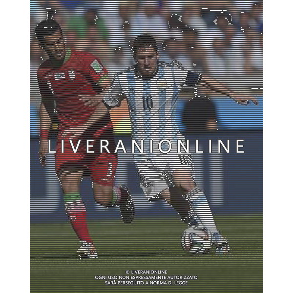 (140621) -- BELO HORIZONTE, June 21, 2014 () -- Lionel Messi (R) of Argentina breaks through during a Group F match between Argentina and Iran of 2014 FIFA World Cup at the Estadio Mineirao Stadium in Belo Horizonte, Brazil, June 21, 2014. Argentina won 1-0. (/Qi Heng)(wll) ©PHOTOSHOT/AGENZIA ALDO LIVERANI SAS - ITALY ONLY - EDITORIAL USE ONLY - ARGENTINA Vs IRAN partita del gruppo di F Coppa del mondo FIFA 2014 Mineirao stadio Estadio a Belo Horizonte, in Brasile, 21 giugno 2014