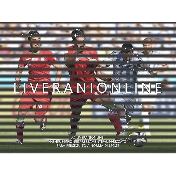 (140621) -- BELO HORIZONTE, June 21, 2014 () -- Lionel Messi (R) of Argentina vies with Reza Haghighi of Iran during a Group F match between Argentina and Iran of 2014 FIFA World Cup at the Estadio Mineirao Stadium in Belo Horizonte, Brazil, June 21, 2014. Argentina won 1-0. (/Qi Heng)(wll) ©PHOTOSHOT/AGENZIA ALDO LIVERANI SAS - ITALY ONLY - EDITORIAL USE ONLY - ARGENTINA Vs IRAN partita del gruppo di F Coppa del mondo FIFA 2014 Mineirao stadio Estadio a Belo Horizonte, in Brasile, 21 giugno 2014