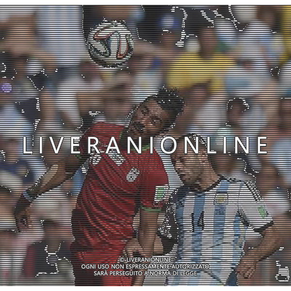 (140621) -- BELO HORIZONTE, June 21, 2014 () -- Reza Ghoochannejad (L) of Iran vies with Javier Mascherano of Argentina during a Group F match between Argentina and Iran of 2014 FIFA World Cup at the Estadio Mineirao Stadium in Belo Horizonte, Brazil, June 21, 2014. Iran lost 0-1. (/Qi Heng)(wll) ©PHOTOSHOT/AGENZIA ALDO LIVERANI SAS - ITALY ONLY - EDITORIAL USE ONLY - ARGENTINA Vs IRAN partita del gruppo di F Coppa del mondo FIFA 2014 Mineirao stadio Estadio a Belo Horizonte, in Brasile, 21 giugno 2014