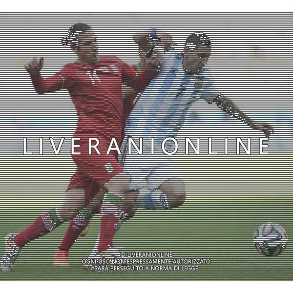 (140621) -- BELO HORIZONTE, June 21, 2014 () -- Angel Di Maria (R) of Argentina vies with Andranik Timotian of Iran during a Group F match between Argentina and Iran of 2014 FIFA World Cup at the Estadio Mineirao Stadium in Belo Horizonte, Brazil, June 21, 2014. Argentina won 1-0. (/Qi Heng)(wll) ©PHOTOSHOT/AGENZIA ALDO LIVERANI SAS - ITALY ONLY - EDITORIAL USE ONLY - ARGENTINA Vs IRAN partita del gruppo di F Coppa del mondo FIFA 2014 Mineirao stadio Estadio a Belo Horizonte, in Brasile, 21 giugno 2014