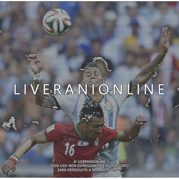 (140621) -- BELO HORIZONTE, June 21, 2014 () -- Marcos Rojo (R) of Argentina vies with Reza Ghoochannejad of Iran during a Group F match between Argentina and Iran of 2014 FIFA World Cup at the Estadio Mineirao Stadium in Belo Horizonte, Brazil, June 21, 2014. Argentina won 1-0. (/Qi Heng)(wll) ©PHOTOSHOT/AGENZIA ALDO LIVERANI SAS - ITALY ONLY - EDITORIAL USE ONLY - ARGENTINA Vs IRAN partita del gruppo di F Coppa del mondo FIFA 2014 Mineirao stadio Estadio a Belo Horizonte, in Brasile, 21 giugno 2014