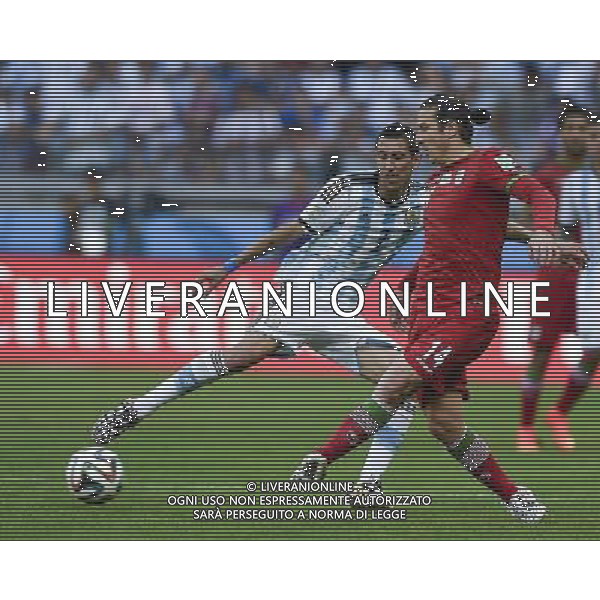 (140621) -- BELO HORIZONTE, June 21, 2014 () -- Andranik Timotian (R) of Iran vies with Angel Di Maria of Argentina during a Group F match between Argentina and Iran of 2014 FIFA World Cup at the Estadio Mineirao Stadium in Belo Horizonte, Brazil, June 21, 2014. Iran lost 0-1. (/Qi Heng)(wll) ©PHOTOSHOT/AGENZIA ALDO LIVERANI SAS - ITALY ONLY - EDITORIAL USE ONLY - ARGENTINA Vs IRAN partita del gruppo di F Coppa del mondo FIFA 2014 Mineirao stadio Estadio a Belo Horizonte, in Brasile, 21 giugno 2014