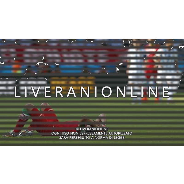 (140621) -- BELO HORIZONTE, June 21, 2014 () -- A player of Iran lies on the pitch after a Group F match between Argentina and Iran of 2014 FIFA World Cup at the Estadio Mineirao Stadium in Belo Horizonte, Brazil, June 21, 2014. Iran lost the match 0-1. (/Liu Bin)(zc) ©PHOTOSHOT/AGENZIA ALDO LIVERANI SAS - ITALY ONLY - EDITORIAL USE ONLY - ARGENTINA Vs IRAN partita del gruppo di F Coppa del mondo FIFA 2014 Mineirao stadio Estadio a Belo Horizonte, in Brasile, 21 giugno 2014