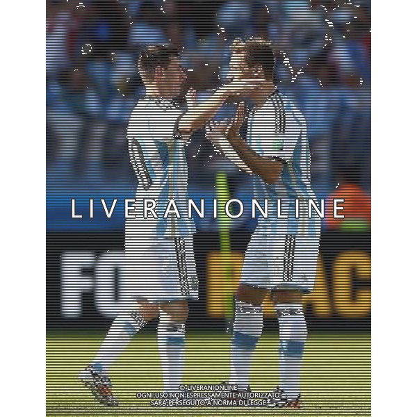 (140621) -- BELO HORIZONTE, June 21, 2014 () -- Lionel Messi (L) of Argentina celebrates with his teammate Lucas Biglia after winning a Group F match between Argentina and Iran of 2014 FIFA World Cup at the Estadio Mineirao Stadium in Belo Horizonte, Brazil, June 21, 2014. Argentina beat Iran 1-0. (/Liu Bin)(zc) ©PHOTOSHOT/AGENZIA ALDO LIVERANI SAS - ITALY ONLY - EDITORIAL USE ONLY - ARGENTINA Vs IRAN partita del gruppo di F Coppa del mondo FIFA 2014 Mineirao stadio Estadio a Belo Horizonte, in Brasile, 21 giugno 2014