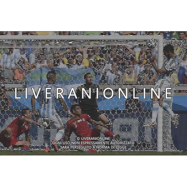 (140621) -- BELO HORIZONTE, June 21, 2014 () -- Ezequiel Garay (1st R) of Argentina makes a header shot during a Group F match between Argentina and Iran of 2014 FIFA World Cup at the Estadio Mineirao Stadium in Belo Horizonte, Brazil, June 21, 2014. (/Qi Heng)(wll) ©PHOTOSHOT/AGENZIA ALDO LIVERANI SAS - ITALY ONLY - EDITORIAL USE ONLY - ARGENTINA Vs IRAN partita del gruppo di F Coppa del mondo FIFA 2014 Mineirao stadio Estadio a Belo Horizonte, in Brasile, 21 giugno 2014