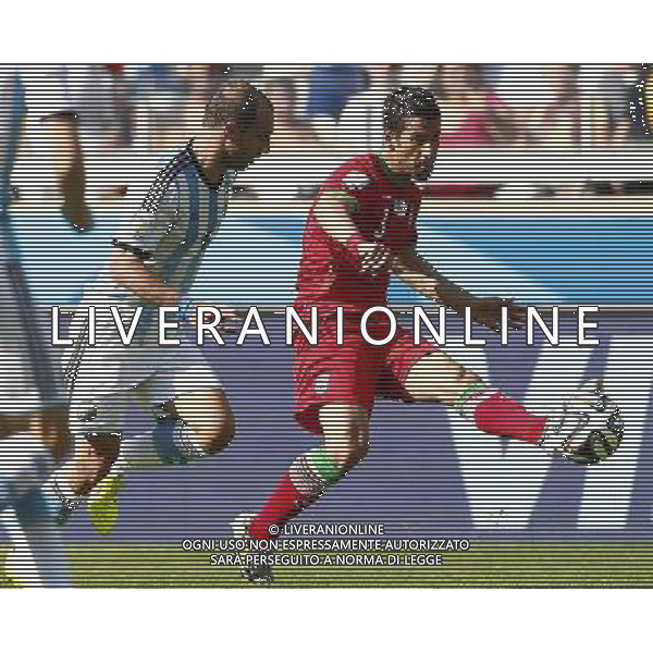 (140621) -- BELO HORIZONTE, June 21, 2014 () -- Ehsan Hajsafi (R) of Iran kicks the ball during a Group F match between Argentina and Iran of 2014 FIFA World Cup at the Estadio Mineirao Stadium in Belo Horizonte, Brazil, June 21, 2014. (/Liu Bin)(zc) ©photoshot/AGENZIA ALDO LIVERANI SAS - ITALY ONLY - ARGENTINA Vs IRAN partita del gruppo di F Coppa del mondo FIFA 2014 Mineirao stadio Estadio a Belo Horizonte, in Brasile, 21 giugno 2014