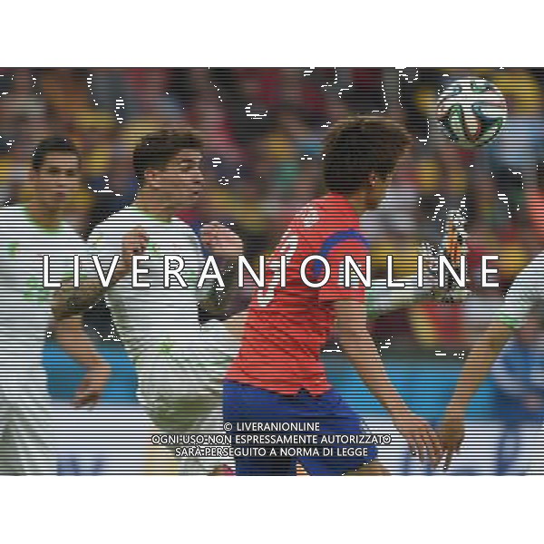 (140622) -- PORTO ALEGRE, June 22, 2014 () -- Koo Ja Cheol (R) of South Korea vies with Carl Medjani of Algeria during a Group H match between Korea Republic and Algeria of 2014 FIFA World Cup at the Estadio Beira-Rio Stadium in Porto Alegre, Brazil, June 22, 2014. Algeria beat Korea Republic 4-2. (/Li Ga)(zc) ©PHOTOSHOT/Agenzia Aldo Liverani sas - ITALY ONLY - EDITORIAL USE ONLY