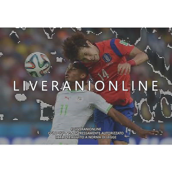 (140622) -- PORTO ALEGRE, June 22, 2014 () -- Han Kook Young£®R£©of Korea Republic fights for the header with Yasine Brahimi of Algeria during a Group H match between Korea Republic and Algeria of 2014 FIFA World Cup at the Estadio Beira-Rio Stadium in Porto Alegre, Brazil, June 22, 2014. Algeria beat Korea Republic 4-2. (/Li Ga)(zc) ©PHOTOSHOT/Agenzia Aldo Liverani sas - ITALY ONLY - EDITORIAL USE ONLY