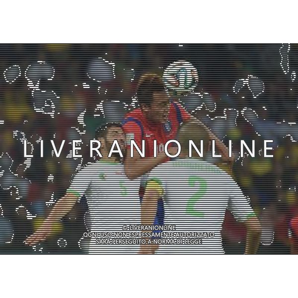 (140622) -- PORTO ALEGRE, June 22, 2014 () -- Kim Shin Wook£®C£©of Korea Republic fights for the header with Rafik Halliche (L) of Algeria during a Group H match between Korea Republic and Algeria of 2014 FIFA World Cup at the Estadio Beira-Rio Stadium in Porto Alegre, Brazil, June 22, 2014. Algeria beat Korea Republic 4-2. (/Li Ga)(zc) ©PHOTOSHOT/Agenzia Aldo Liverani sas - ITALY ONLY - EDITORIAL USE ONLY