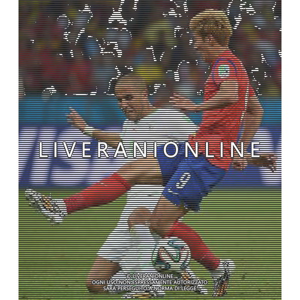 (140622) -- PORTO ALEGRE, June 22, 2014 () -- Son Heung Min (R) of Korea Republic vies with Madjid Bougherra of Algeria during a Group H match between Korea Republic and Algeria of 2014 FIFA World Cup at the Estadio Beira-Rio Stadium in Porto Alegre, Brazil, June 22, 2014. Algeria beat Korea Republic 4-2. (/Li Ga)(zc) ©PHOTOSHOT/Agenzia Aldo Liverani sas - ITALY ONLY - EDITORIAL USE ONLY