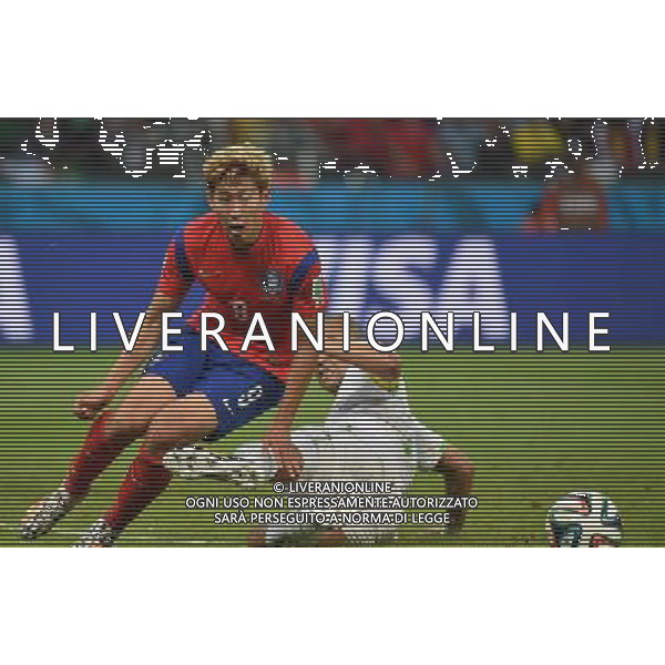 (140622) -- PORTO ALEGRE, June 22, 2014 () -- Son Heung Min (L) of Korea Republic vies with Madjid Bouguerra of Algeria during a Group H match between Korea Republic and Algeria of 2014 FIFA World Cup at the Estadio Beira-Rio Stadium in Porto Alegre, Brazil, June 22, 2014. Algeria beat Korea Republic 4-2. (/Li Ga)(zc) ©PHOTOSHOT/Agenzia Aldo Liverani sas - ITALY ONLY - EDITORIAL USE ONLY