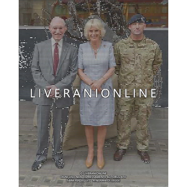 London, UK, 24/06/2014 : THE DUCHESS OF CORNWALL VISITS THE \'VOICES FROM THE DESERT\' EXHIBITION. The Duchess of Cornwall, Patron, Desert Rats Association, visits \'Voices from the Desert\', a Desert Rats exhibition by the artist Anna Redwood. The exhibition features an 11ft high, heavy-metal RAT sculpture - designed and constructed by Anna from scrapped vehicles found in the desert. The British Army has transported this regimental mascot all the way back from Camp Bastion and it will be on display at the La Galleria Pall Mall for this exhibition before it is moved to a permanent home with the 7th Armoured Brigade - The Desert Rats.. Picture by Julie Edwards ©PHOTOSHOT/Agenzia Aldo Liverani sas - ITALY ONLY - EDITORIAL USE ONLY - REALI INGLESI: Camilla duchessa di Cornovaglia in visita alla mostra \'Voci dal deserto\' dell\'artista Anna Redwood