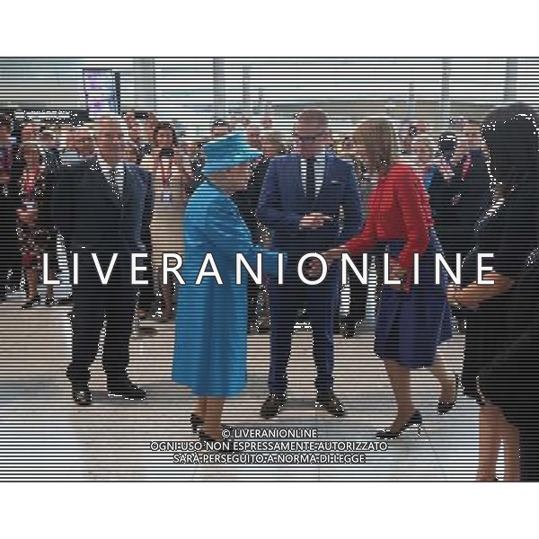 Queen Elizabeth II meets designer Cath Kidston while being shown around the new Terminal 2 The Queen\'s Terminal at Heathrow Airport, during the official opening of the new terminal. ©photoshot/Agenzia Aldo Liverani sas - ITALY ONLY - EDITORIAL USE ONLY