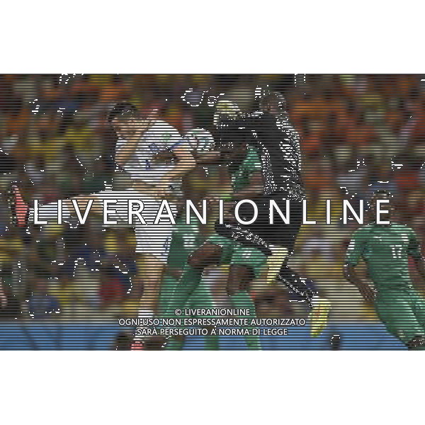 (140624) -- FORTALEZA, June 24, 2014 () -- Cote d\'Ivoire\'s goalkeeper Boubacar Barry (1st R, top) blocks the ball during a Group C match between Greece and Cote d\'Ivoire of 2014 FIFA World Cup at the Estadio Castelao Stadium in Fortaleza, Brazil, June 24, 2014. (/Yang Lei)(xzj) AG ALDO LIVERANI SAS ONLY ITALY