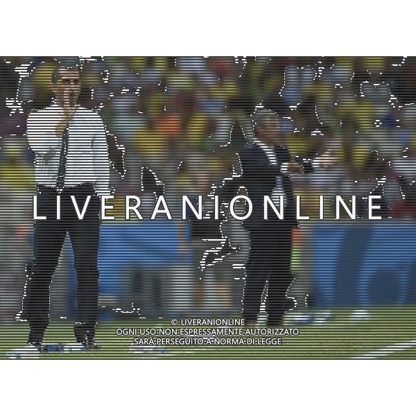 (140624) -- FORTALEZA, June 24, 2014 () -- Cote d\'Ivoire\'s head coach Sabri Lamouchi (L) gives instruction during a Group C match between Greece and Cote d\'Ivoire of 2014 FIFA World Cup at the Estadio Castelao Stadium in Fortaleza, Brazil, June 24, 2014. (/Yang Lei)(xzj) AG ALDO LIVERANI SAS ONLY ITALY