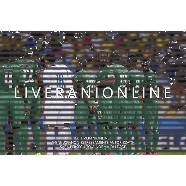 (140624) -- FORTALEZA, June 24, 2014 () -- Cote d\'Ivoire\'s Didier Drogba (4th R) looks back as he forms a wall with ohter players during a Group C match between Greece and Cote d\'Ivoire of 2014 FIFA World Cup at the Estadio Castelao Stadium in Fortaleza, Brazil, June 24, 2014. (/Yang Lei)(xzj) AG ALDO LIVERANI SAS ONLY ITALY