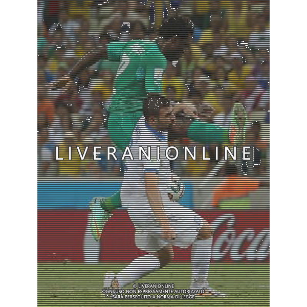 (140624) -- FORTALEZA, June 24, 2014 () -- Cote d\'Ivoire\'s Wilfried Bony (top) shoots the ball during a Group C match between Greece and Cote d\'Ivoire of 2014 FIFA World Cup at the Estadio Castelao Stadium in Fortaleza, Brazil, June 24, 2014. Greece won 2-1 over Cote d\'Ivoire on Tuesday. (/Cao Can)(xzj) AG ALDO LIVERANI SAS ONLY ITALY