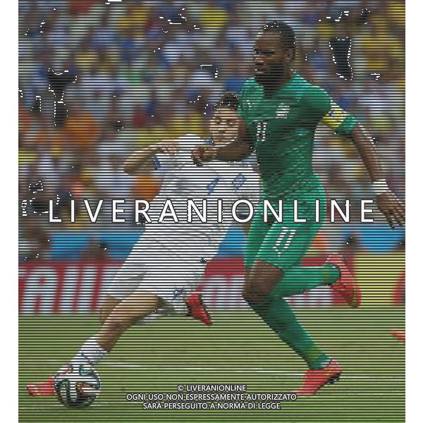 (140624) -- FORTALEZA, June 24, 2014 () -- Greece\'s Kostas Manolas (L) vies with Cote d\'Ivoire\'s Didier Drogba during a Group C match between Greece and Cote d\'Ivoire of 2014 FIFA World Cup at the Estadio Castelao Stadium in Fortaleza, Brazil, June 24, 2014. Greece won 2-1 over Cote d\'Ivoire on Tuesday. (/Cao Can)(xzj) AG ALDO LIVERANI SAS ONLY ITALY