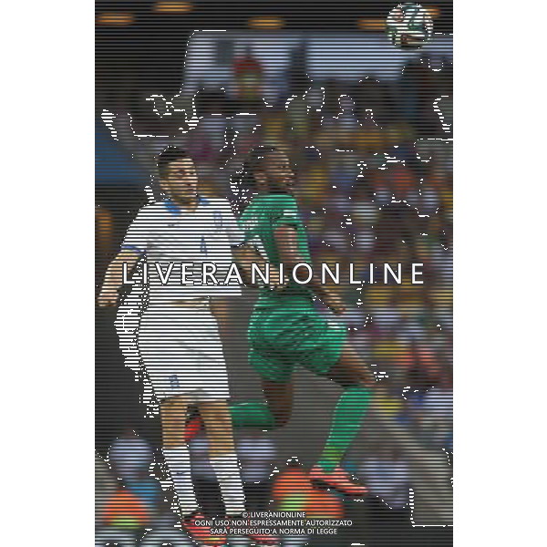 (140624) -- FORTALEZA, June 24, 2014 () -- Greece\'s Kostas Manolas (L) competes for a header with Cote d\'Ivoire\'s Didier Drogba during a Group C match between Greece and Cote d\'Ivoire of 2014 FIFA World Cup at the Estadio Castelao Stadium in Fortaleza, Brazil, June 24, 2014. (/Cao Can)(xzj) AG ALDO LIVERANI SAS ONLY ITALY