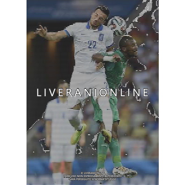 (140624) -- FORTALEZA, June 24, 2014 () -- Greece\'s Andreas Samaris (L) competes for a header with Cote d\'Ivoire\'s Geoffroy Serey Die during a Group C match between Greece and Cote d\'Ivoire of 2014 FIFA World Cup at the Estadio Castelao Stadium in Fortaleza, Brazil, June 24, 2014. (/Yang Lei)(xzj) AG ALDO LIVERANI SAS ONLY ITALY