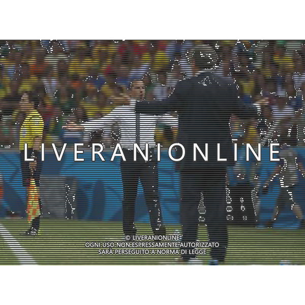 (140624) -- FORTALEZA, June 24, 2014 () -- Greece\'s head coach Fernando Santos (R) reacts with Cote d\'Ivoire\'s head coach Sabri Lamouchi (C) during a Group C match between Greece and Cote d\'Ivoire of 2014 FIFA World Cup at the Estadio Castelao Stadium in Fortaleza, Brazil, June 24, 2014. (/Cao Can)(xzj) AG ALDO LIVERANI SAS ONLY ITALY