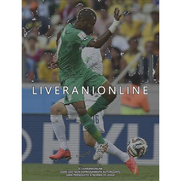 (140624) -- FORTALEZA, June 24, 2014 () -- Cote d\'Ivoire\'s Geoffroy Serey Die (front) vies for the ball during a Group C match between Greece and Cote d\'Ivoire of 2014 FIFA World Cup at the Estadio Castelao Stadium in Fortaleza, Brazil, June 24, 2014. (/Yang Lei)(xzj) AG ALDO LIVERANI SAS ONLY ITALY