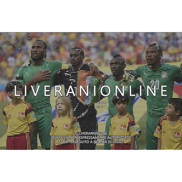 (140624) -- FORTALEZA, June 24, 2014 () -- Cote d\'Ivoire\'s players Didier Drogba, Boubacar Barry, Arthur Boka and Geoffroy Serey Die (L to R, back) sing the national anthem prior to a Group C match between Greece and Cote d\'Ivoire of 2014 FIFA World Cup at the Estadio Castelao Stadium in Fortaleza, Brazil, June 24, 2014. (/Yang Lei)(xzj) AG ALDO LIVERANI SAS ONLY ITALY