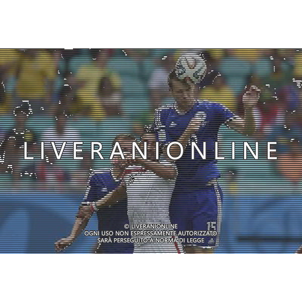 (140625) -- SALVADOR, June 25, 2014 () -- Bosnia And Herzegovina\'s Toni Sunjic jumps for a header during a Group F match between Bosnia And Herzegovina and Iran of 2014 FIFA World Cup at the Arena Fonte Nova Stadium in Salvador, Brazil, June 24, 2014. (/Yang Lei) AG ALDO LIVERANI SAS ONLY ITALY
