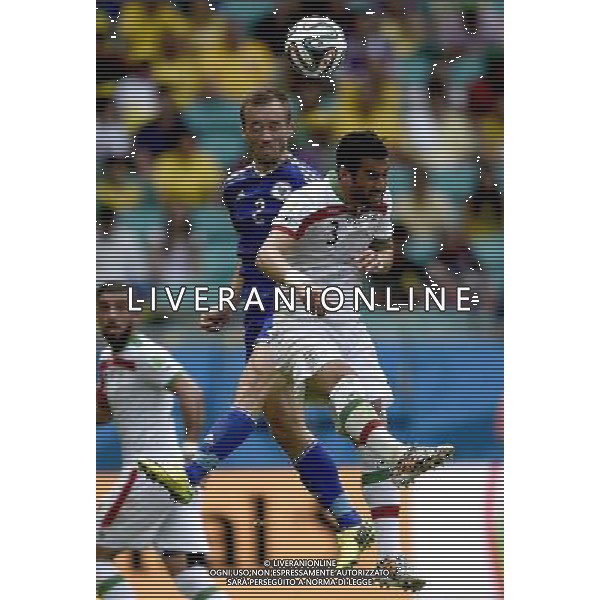 (140625) -- SALVADOR, June 25, 2014 () -- Bosnia And Herzegovina\'s Avdija Vrsaljevic competes for a header with Iran\'s Ehsan Hajsafi during a Group F match between Bosnia And Herzegovina and Iran of 2014 FIFA World Cup at the Arena Fonte Nova Stadium in Salvador, Brazil, June 24, 2014. (/Yang Lei) AG ALDO LIVERANI SAS ONLY ITALY
