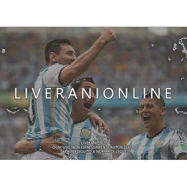 (140625) -- PORTO ALEGRE, June 25, 2014 () -- Argentina\'s Lionel Messi (L) celebrates for scoring a goal during a Group F match between Nigeria and Argentina of 2014 FIFA World Cup at the Estadio Beira-Rio Stadium in Porto Alegre, Brazil, on June 25, 2014.(/Li Ga)(pcy) AG ALDO LIVERANI SAS ONLY ITALY