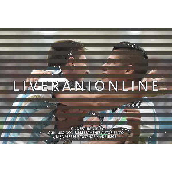 (140625) -- PORTO ALEGRE, June 25, 2014 () -- Argentina\'s Lionel Messi (L) celebrates for scoring a goal during a Group F match between Nigeria and Argentina of 2014 FIFA World Cup at the Estadio Beira-Rio Stadium in Porto Alegre, Brazil, on June 25, 2014.(/Li Ga)(pcy) AG ALDO LIVERANI SAS ONLY ITALY