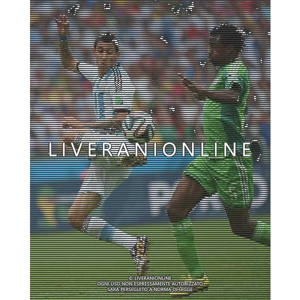 (140625) -- PORTO ALEGRE, June 25, 2014 () -- Argentina\'s Angel Di Maria (L) vies with Nigeria\'s Efe Ambrose during a Group F match between Nigeria and Argentina of 2014 FIFA World Cup at the Estadio Beira-Rio Stadium in Porto Alegre, Brazil, on June 25, 2014.(/Li Ga)(pcy) AG ALDO LIVERANI SAS ONLY ITALY