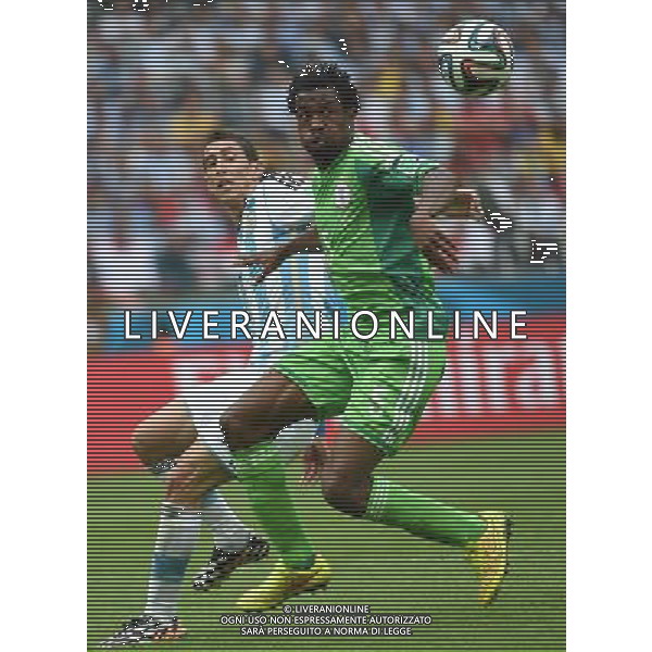 (140625) -- PORTO ALEGRE, June 25, 2014 () -- Argentina\'s Angel Di Maria (L) vies with Nigeria\'s Efe Ambrose during a Group F match between Nigeria and Argentina of 2014 FIFA World Cup at the Estadio Beira-Rio Stadium in Porto Alegre, Brazil, on June 25, 2014.(/Li Ga)(pcy) AG ALDO LIVERANI SAS ONLY ITALY
