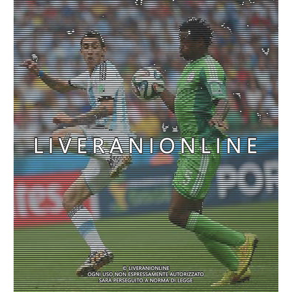 (140625) -- PORTO ALEGRE, June 25, 2014 () -- Argentina\'s Angel Di Maria (L) vies with Nigeria\'s Efe Ambrose during a Group F match between Nigeria and Argentina of 2014 FIFA World Cup at the Estadio Beira-Rio Stadium in Porto Alegre, Brazil, on June 25, 2014.(/Li Ga)(pcy) AG ALDO LIVERANI SAS ONLY ITALY