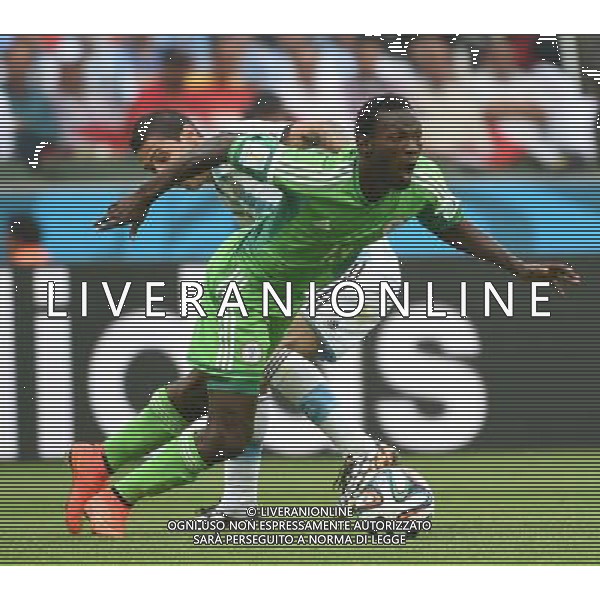 (140625) -- PORTO ALEGRE, June 25, 2014 () -- Argentina\'s Angel Di Maria (back) vies with Nigeria\'s Juwon Oshaniwa during a Group F match between Nigeria and Argentina of 2014 FIFA World Cup at the Estadio Beira-Rio Stadium in Porto Alegre, Brazil, on June 25, 2014.(/Li Ga)(pcy) AG ALDO LIVERANI SAS ONLY ITALY