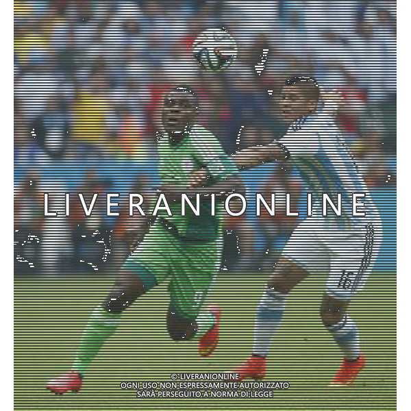 (140625) -- PORTO ALEGRE, June 25, 2014 () -- Argentina\'s Marcos Rojo (R) vies with Nigeria\'s Emmanuel Emenike during a Group F match between Nigeria and Argentina of 2014 FIFA World Cup at the Estadio Beira-Rio Stadium in Porto Alegre, Brazil, on June 25, 2014.(/Chen Jianli)(pcy) AG ALDO LIVERANI SAS ONLY ITALY