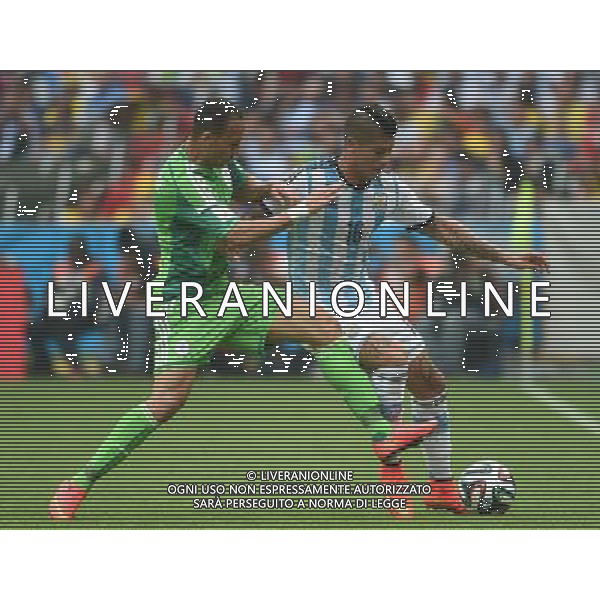 (140625) -- PORTO ALEGRE, June 25, 2014 () -- Argentina\'s Marcos Rojo (R) vies with Nigeria\'s Peter Osaze Odemwingie during a Group F match between Nigeria and Argentina of 2014 FIFA World Cup at the Estadio Beira-Rio Stadium in Porto Alegre, Brazil, on June 25, 2014.(/Li Ga)(pcy) AG ALDO LIVERANI SAS ONLY ITALY