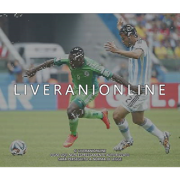 (140625) -- PORTO ALEGRE, June 25, 2014 () -- Nigeria\'s Emmanuel Emenike (L) vies with Argentina\'s Ezequiel Garay during a Group F match between Nigeria and Argentina of 2014 FIFA World Cup at the Estadio Beira-Rio Stadium in Porto Alegre, Brazil, on June 25, 2014.(/Chen Jianli)(pcy) AG ALDO LIVERANI SAS ONLY ITALY