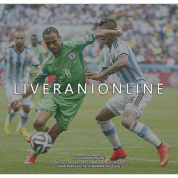 (140625) -- PORTO ALEGRE, June 25, 2014 () -- Nigeria\'s Peter Osaze Odemwingie (L, front) vies with Argentina\'s Marcos Rojo during a Group F match between Nigeria and Argentina of 2014 FIFA World Cup at the Estadio Beira-Rio Stadium in Porto Alegre, Brazil, on June 25, 2014.(/Chen Jianli)(pcy) AG ALDO LIVERANI SAS ONLY ITALY