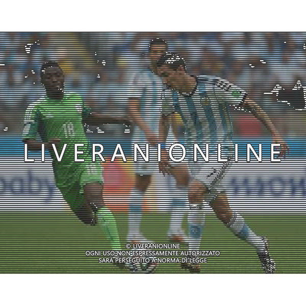 (140625) -- PORTO ALEGRE, June 25, 2014 () -- Argentina\'s Angel Di Maria (R, front) controls the ball during a Group F match between Nigeria and Argentina of 2014 FIFA World Cup at the Estadio Beira-Rio Stadium in Porto Alegre, Brazil, on June 25, 2014.(/Li Ga)(pcy) AG ALDO LIVERANI SAS ONLY ITALY