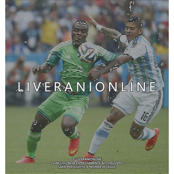 (140625) -- PORTO ALEGRE, June 25, 2014 () -- Argentina\'s Marcos Rojo (R) vies with Nigeria\'s Emmanuel Emenike during a Group F match between Nigeria and Argentina of 2014 FIFA World Cup at the Estadio Beira-Rio Stadium in Porto Alegre, Brazil, on June 25, 2014.(/Chen Jianli)(pcy) AG ALDO LIVERANI SAS ONLY ITALY