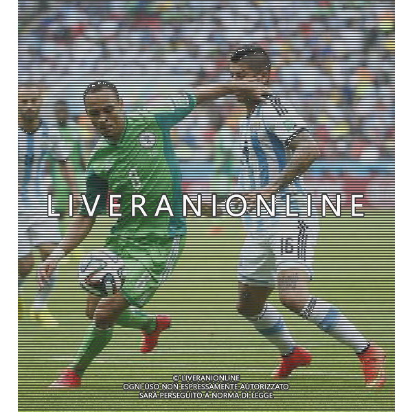 (140625) -- PORTO ALEGRE, June 25, 2014 () -- Nigeria\'s Peter Osaze Odemwingie (L, front) vies with Argentina\'s Marcos Rojo during a Group F match between Nigeria and Argentina of 2014 FIFA World Cup at the Estadio Beira-Rio Stadium in Porto Alegre, Brazil, on June 25, 2014.(/Chen Jianli)(pcy) AG ALDO LIVERANI SAS ONLY ITALY