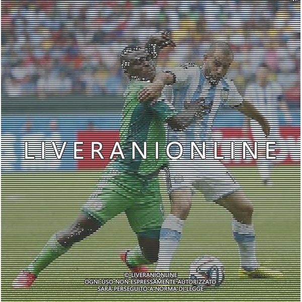 (140625) -- PORTO ALEGRE, June 25, 2014 () -- Argentina\'s Javier Mascherano (R) vies with Nigeria\'s Emmanuel Emenike during a Group F match between Nigeria and Argentina of 2014 FIFA World Cup at the Estadio Beira-Rio Stadium in Porto Alegre, Brazil, on June 25, 2014.(/Chen Jianli)(pcy) AG ALDO LIVERANI SAS ONLY ITALY