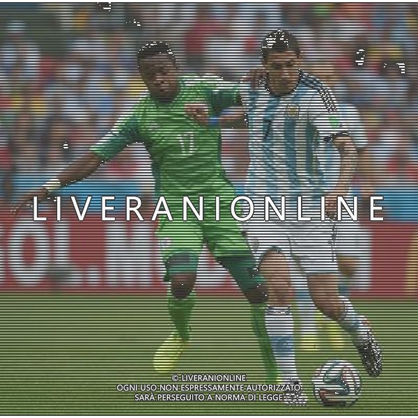 (140625) -- PORTO ALEGRE, June 25, 2014 () -- Argentina\'s Angel Di Maria (R) vies with Nigeria\'s Ogenyi Onazi during a Group F match between Nigeria and Argentina of 2014 FIFA World Cup at the Estadio Beira-Rio Stadium in Porto Alegre, Brazil, on June 25, 2014.(/Li Ga)(pcy) AG ALDO LIVERANI SAS ONLY ITALY