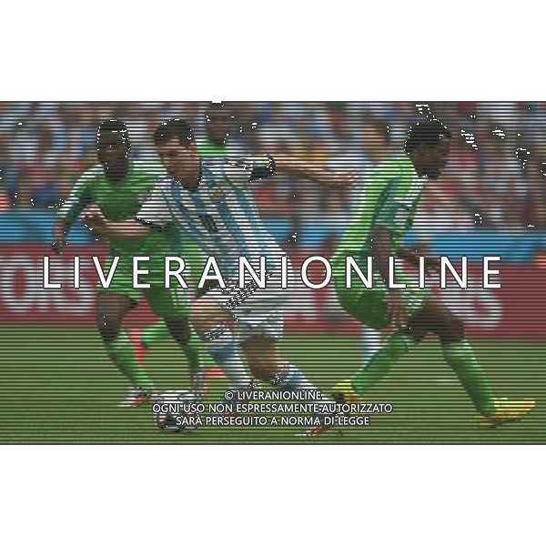 (140625) -- PORTO ALEGRE, June 25, 2014 () -- Argentina\'sLionel Messi (front) runs with the ball during a Group F match between Nigeria and Argentina of 2014 FIFA World Cup at the Estadio Beira-Rio Stadium in Porto Alegre, Brazil, on June 25, 2014.(/Li Ga)(pcy) AG ALDO LIVERANI SAS ONLY ITALY