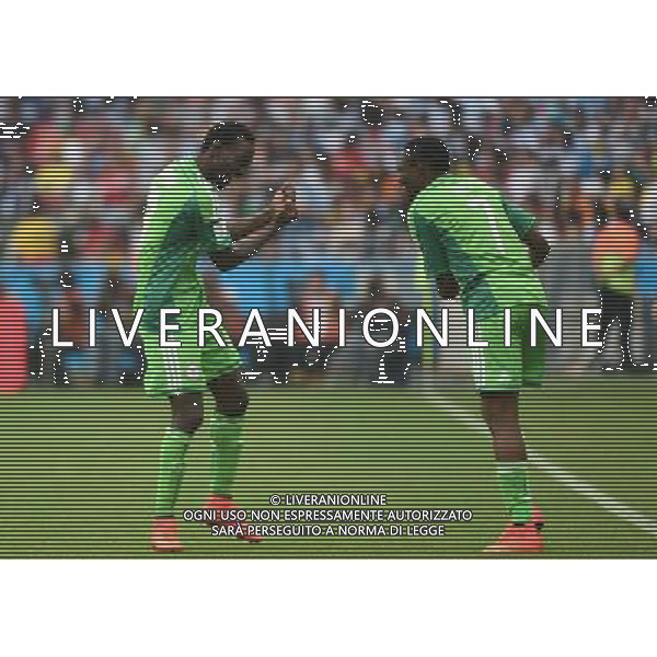 (140625) -- PORTO ALEGRE, June 25, 2014 () -- Nigeria\'s Ahmed Musa (R) celebrates for scoring his second goal during a Group F match between Nigeria and Argentina of 2014 FIFA World Cup at the Estadio Beira-Rio Stadium in Porto Alegre, Brazil, on June 25, 2014.(/Li Ga)(pcy) AG ALDO LIVERANI SAS ONLY ITALY