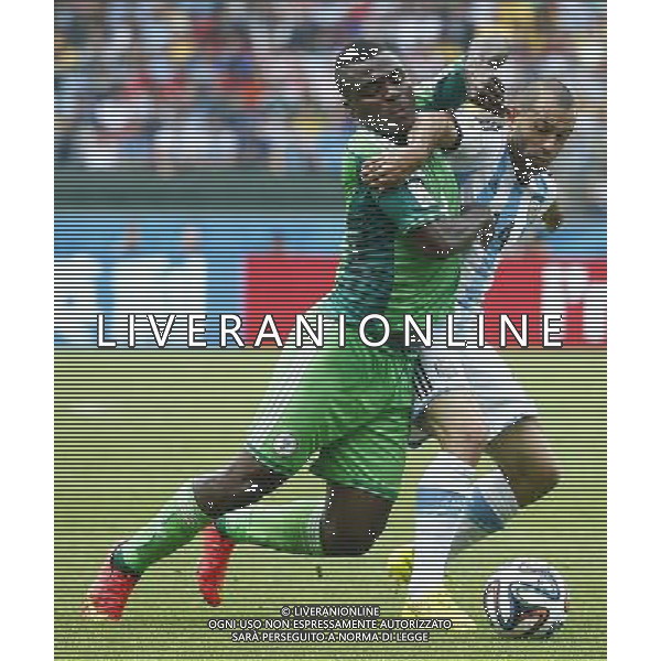 (140625) -- PORTO ALEGRE, June 25, 2014 () -- Nigeria\'s Emmanuel Emenike (L) vies with Argentina\'s Javier Mascherano during a Group F match between Nigeria and Argentina of 2014 FIFA World Cup at the Estadio Beira-Rio Stadium in Porto Alegre, Brazil, on June 25, 2014.(/Chen Jianli)(pcy) AG ALDO LIVERANI SAS ONLY ITALY