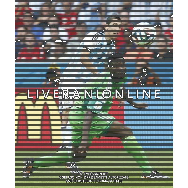 (140625) -- PORTO ALEGRE, June 25, 2014 () -- Argentina\'s Angel Di Maria (back) vies with Nigeria\'s Joseph Yobo during a Group F match between Nigeria and Argentina of 2014 FIFA World Cup at the Estadio Beira-Rio Stadium in Porto Alegre, Brazil, on June 25, 2014.(/Chen Jianli)(pcy) AG ALDO LIVERANI SAS ONLY ITALY