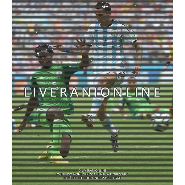 (140625) -- PORTO ALEGRE, June 25, 2014 () -- Argentina\'s Angel Di Maria (R, front) vies with Nigeria\'s Efe Ambrose during a Group F match between Nigeria and Argentina of 2014 FIFA World Cup at the Estadio Beira-Rio Stadium in Porto Alegre, Brazil, on June 25, 2014.(/Li Ga)(pcy) AG ALDO LIVERANI SAS ONLY ITALY