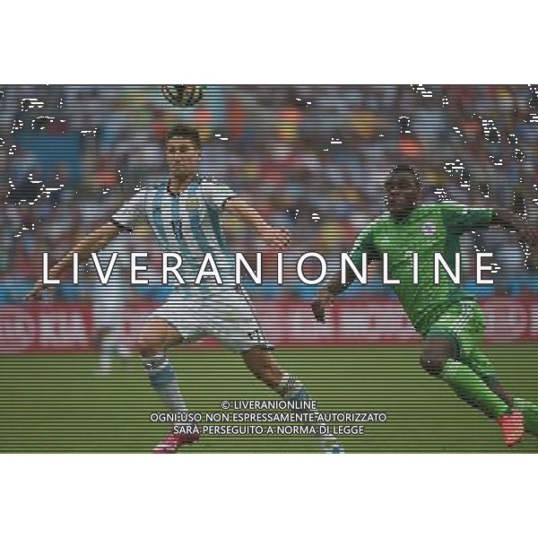 (140625) -- PORTO ALEGRE, June 25, 2014 () -- Argentina\'s Federico Fernandez (L) vies with Nigeria\'s Emmanuel Emenike during a Group F match between Nigeria and Argentina of 2014 FIFA World Cup at the Estadio Beira-Rio Stadium in Porto Alegre, Brazil, on June 25, 2014.(/Li Ga)(pcy) AG ALDO LIVERANI SAS ONLY ITALY